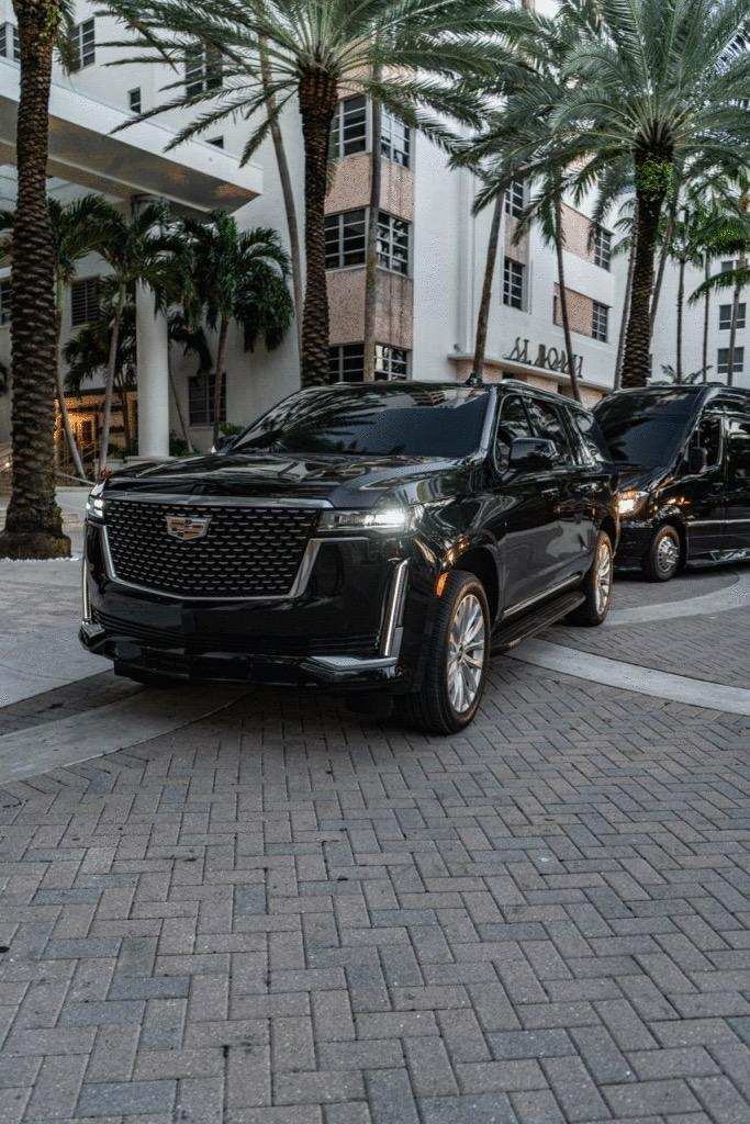 Black Soluxe SUV arriving for a private evening engagement
